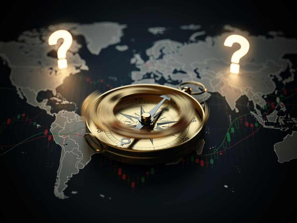 Compass spinning wildly on a dark map with question marks, market direction uncertainty metaphor