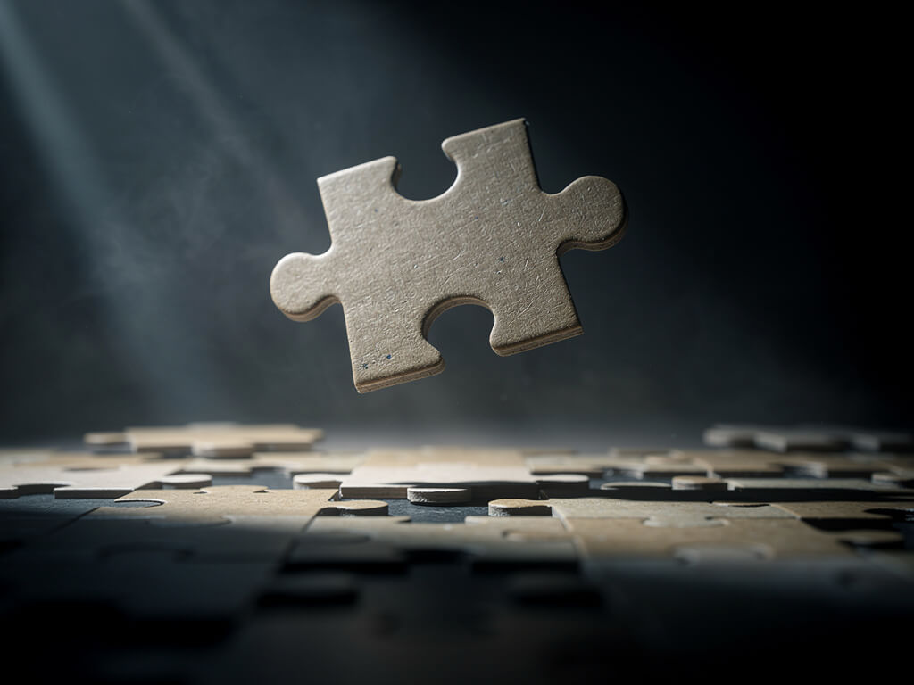 Puzzle piece floating above a puzzle board almost fitting but not quite, dark atmospheric lighting